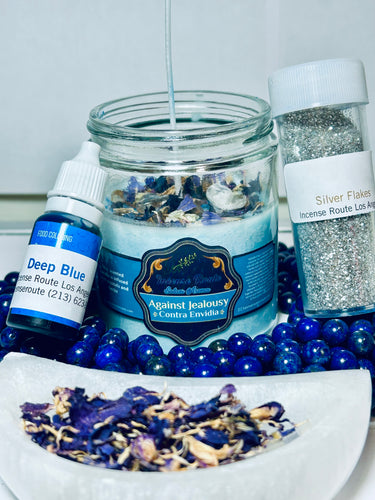 Handmade scented blue candle with herbs and crystals