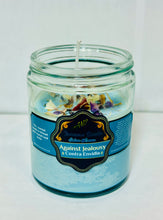 Handmade scented blue candle with herbs and crystals