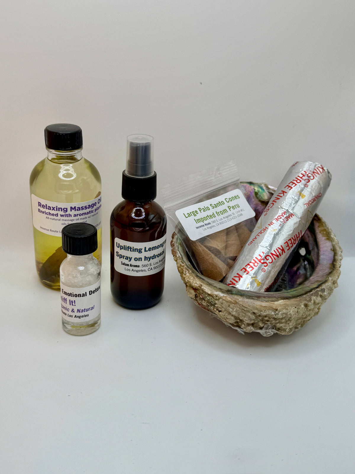 Relaxing Bundle with massage oil, portable salt therapy, Palo Santo cones, charcoal, abalone shell, and lemongrass hydrosol spray